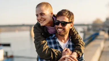 A couple walking by water