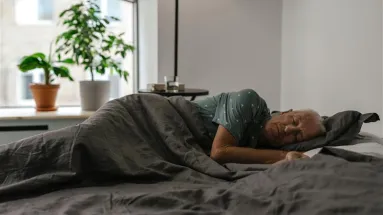 Lady sleeping with blanket over her