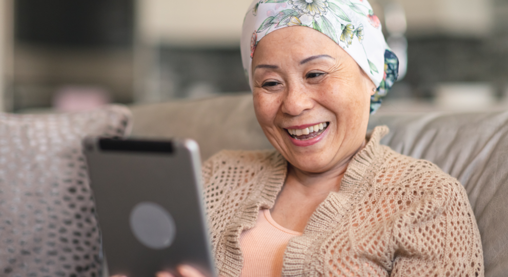Woman on ipad while sitting on couch