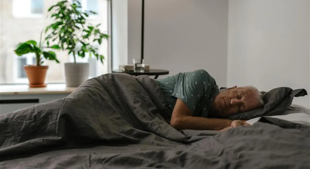 Lady sleeping with blanket over her