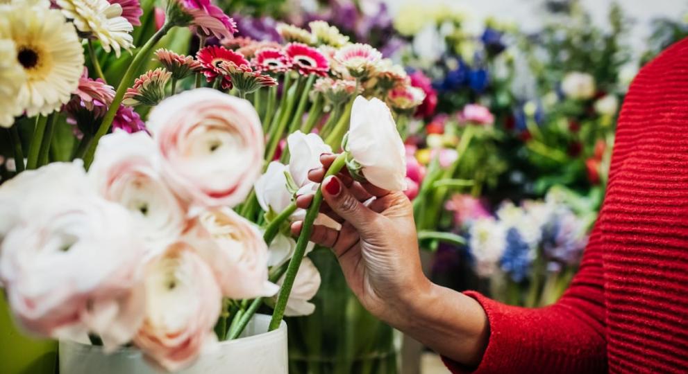 person painting flowers