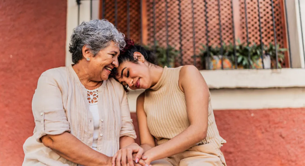 two ladies comforting one another
