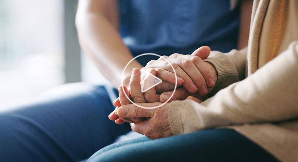 cropped-shot-of-senior-woman-holding-hands-with-a-nurse